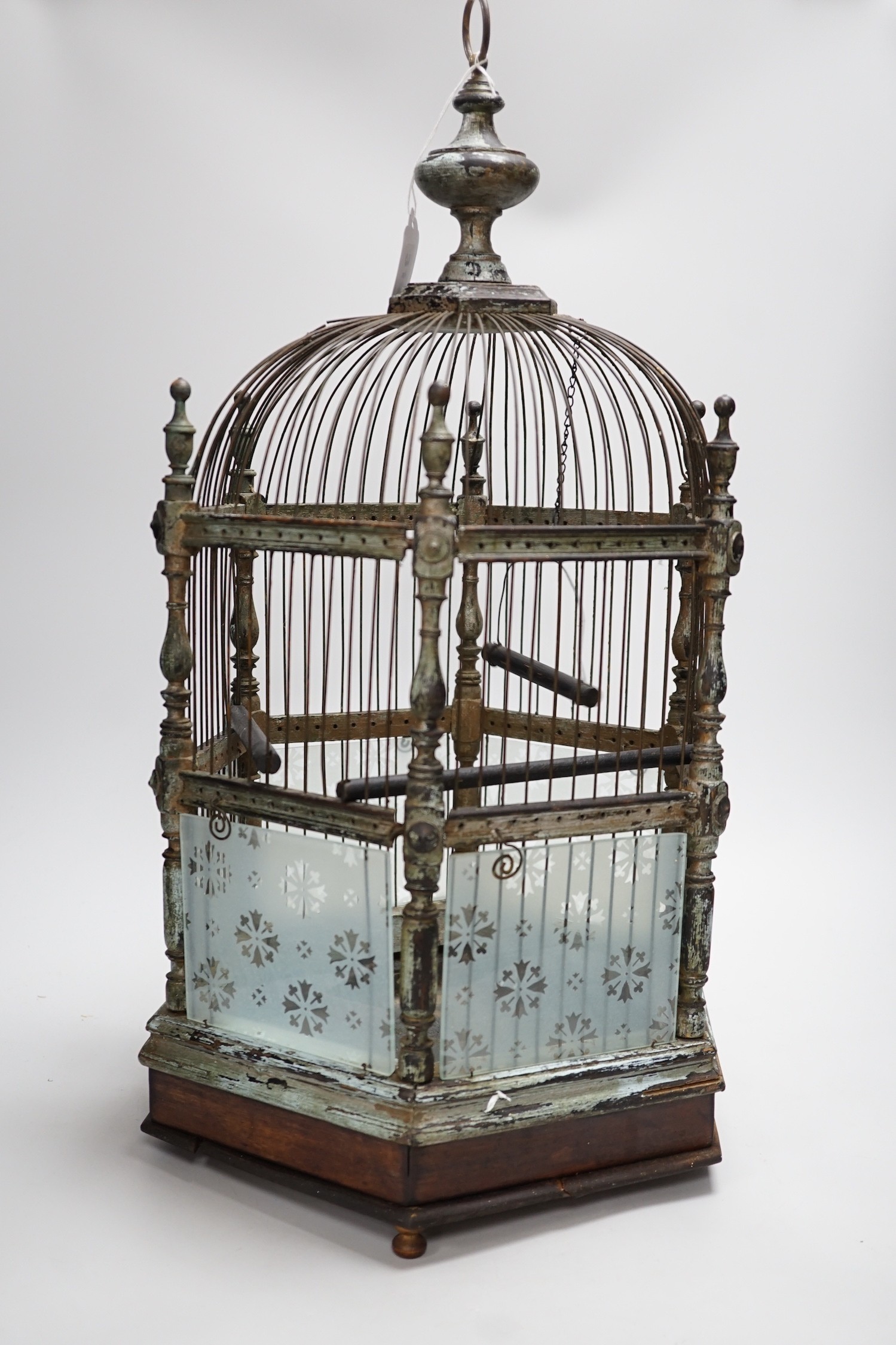A Victorian brass and glass bird cage. 59cm tall